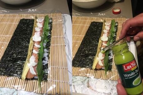 selbstgemachtes Sushi mit dem ersten Schritt, der Belegung des Nori Blattes
