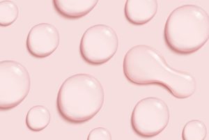 Animation in rosa mit Wassertropfen symbolisch für Hyaluron